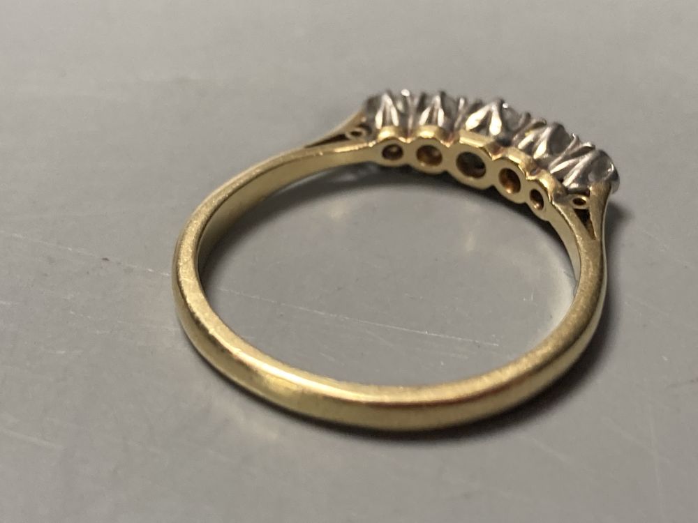 An 18ct and graduated five-stone diamond half-hoop ring and a diamond solitaire ring